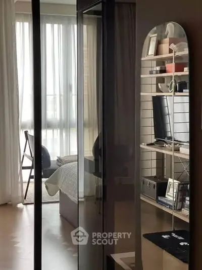 Modern bedroom with sleek design and ample natural light