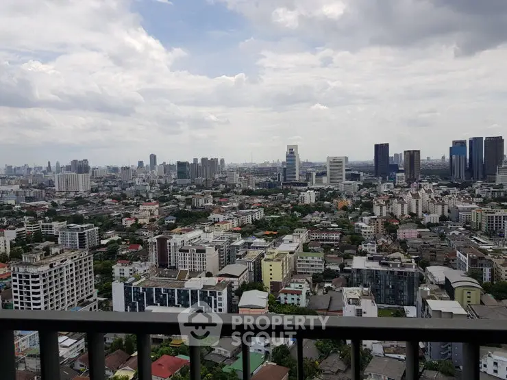 Stunning cityscape view from a high-rise balcony showcasing urban skyline and architecture.