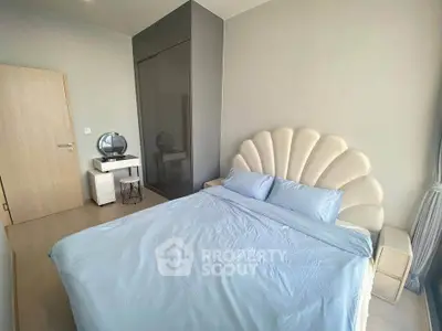 Modern bedroom with stylish shell-shaped headboard and sleek wardrobe