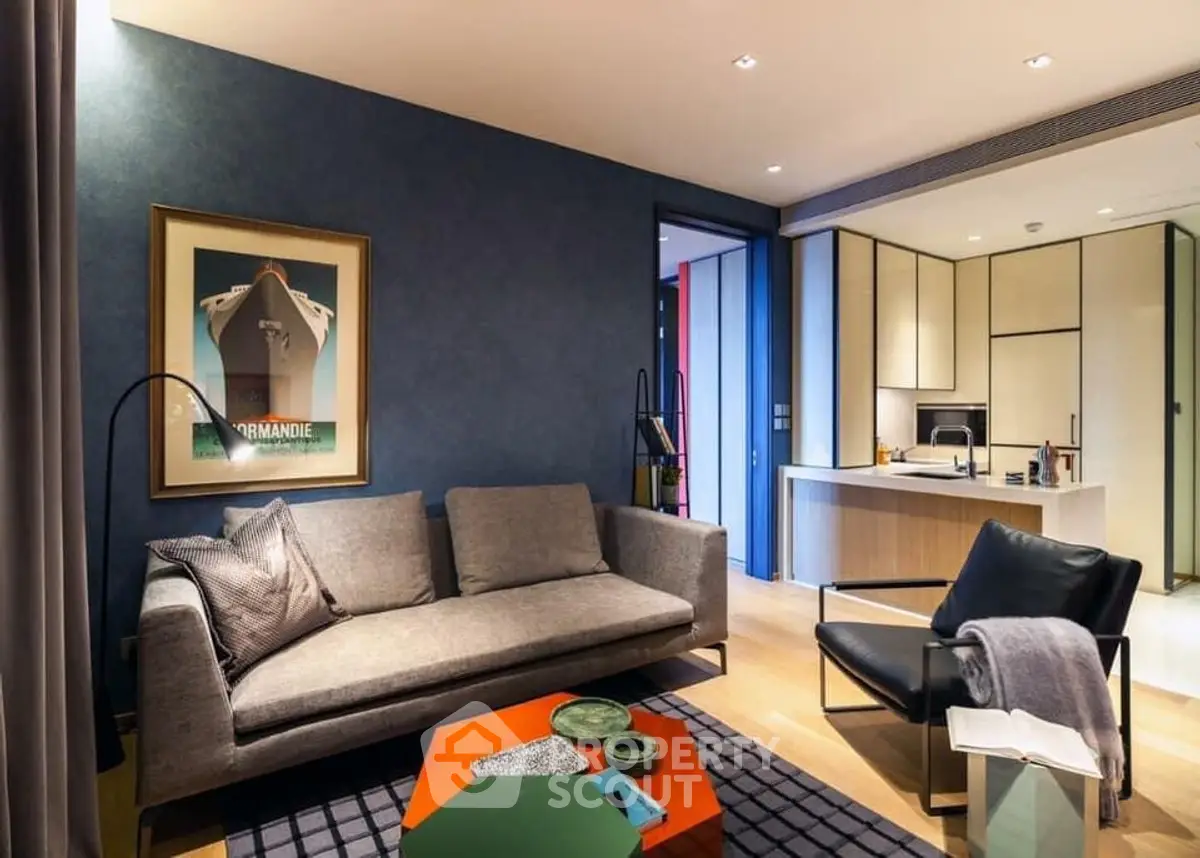 Modern living room with stylish furniture and open kitchen layout, perfect for contemporary urban living.