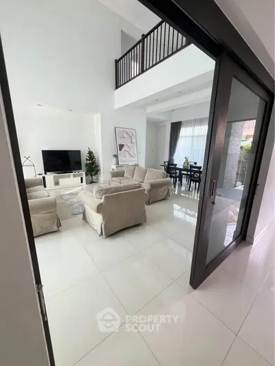 Spacious modern living room with high ceilings and elegant decor
