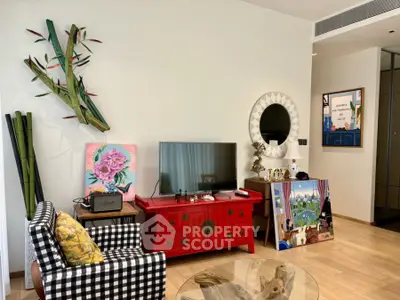 Chic living room with vibrant decor and modern TV setup, perfect for stylish urban living.