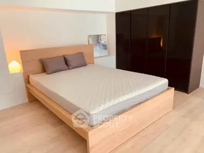 Modern bedroom with sleek design and spacious wardrobe