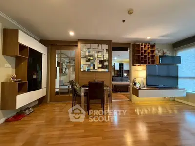 Modern living room with stylish decor and wooden flooring