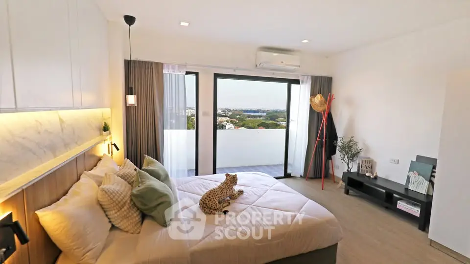 Luxurious bedroom with stunning balcony view and modern decor