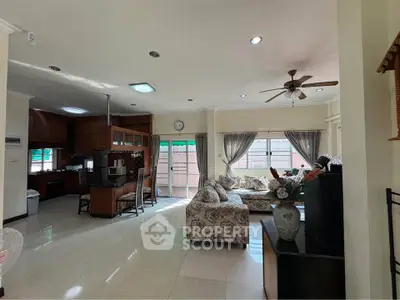 Spacious living room with elegant furniture and open kitchen layout