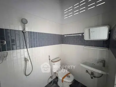 Modern bathroom with sleek shower and minimalist design in a contemporary home.