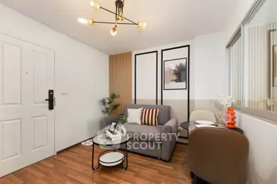 Stylish living room with modern decor and cozy seating area, perfect for relaxation and entertaining.