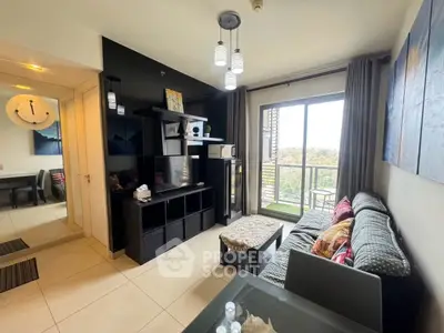 Modern living room with balcony view, stylish decor, and ample natural light.
