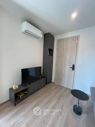 Modern living room with sleek furniture and air conditioning