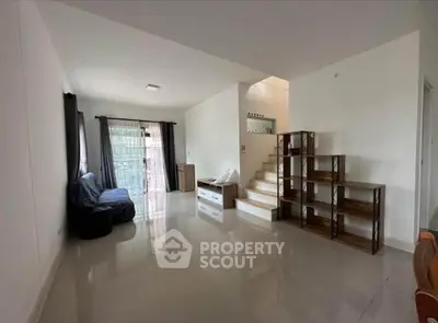 Spacious modern living room with sleek design and natural light