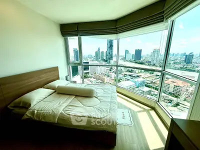 Luxurious bedroom with panoramic city view and modern decor