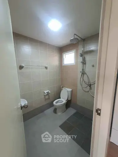 Modern bathroom with shower and toilet in minimalist design