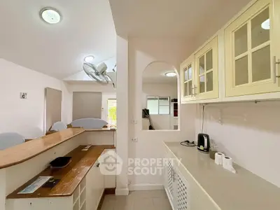 Charming kitchen with open layout and modern cabinetry, perfect for culinary enthusiasts.