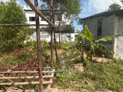 Charming rustic property with lush greenery and potential for development in a serene setting.