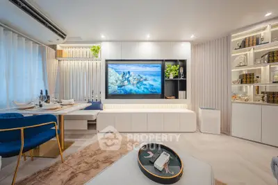 Luxurious modern living room with elegant decor and large TV, perfect for relaxation and entertainment.