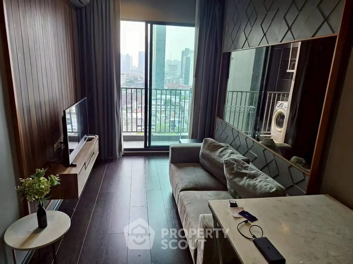 Modern living room with city view, featuring sleek furniture and a washing machine.