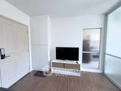 Modern living room with sleek TV stand and wooden flooring, perfect for cozy entertainment.