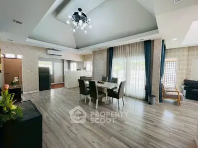 Spacious modern living room with elegant dining area and stylish lighting