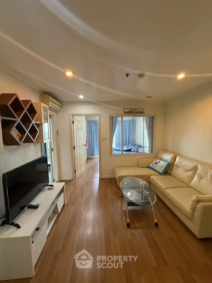 Spacious living room with modern decor and natural light