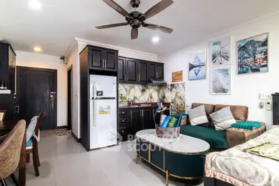 Modern open-layout living room with stylish kitchen and cozy seating area