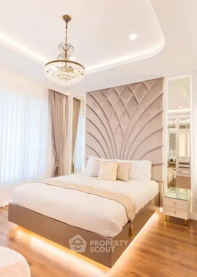 Luxurious bedroom with elegant chandelier and modern design