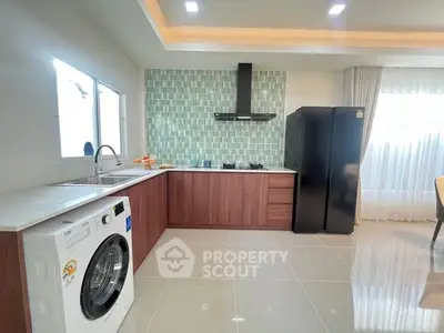 Modern kitchen with sleek appliances and stylish cabinetry