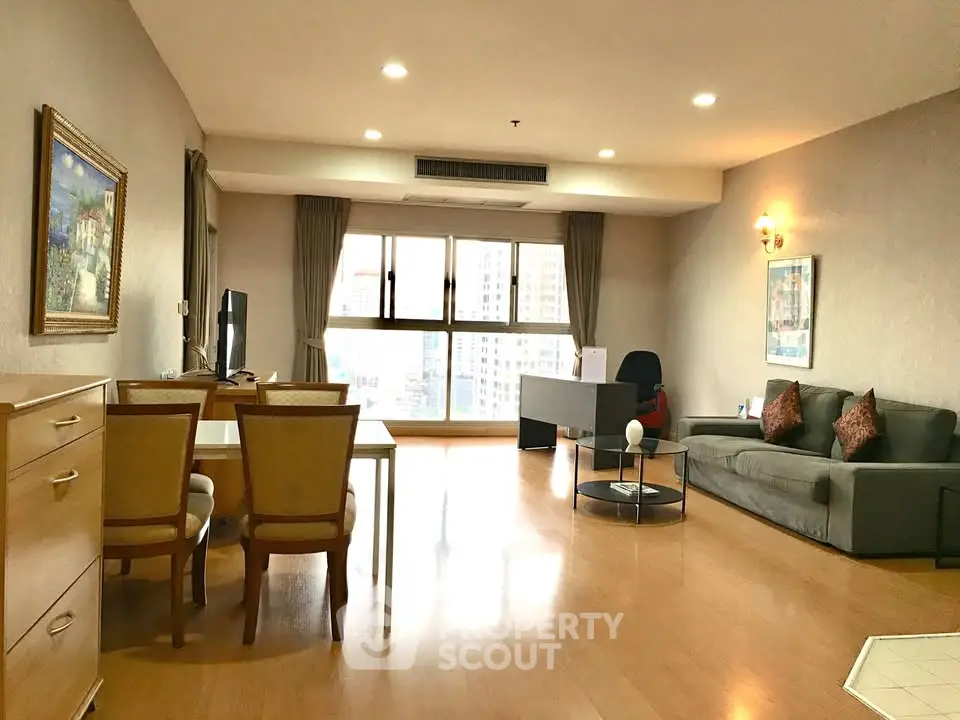 Spacious living room with modern decor and city view, perfect for urban living.