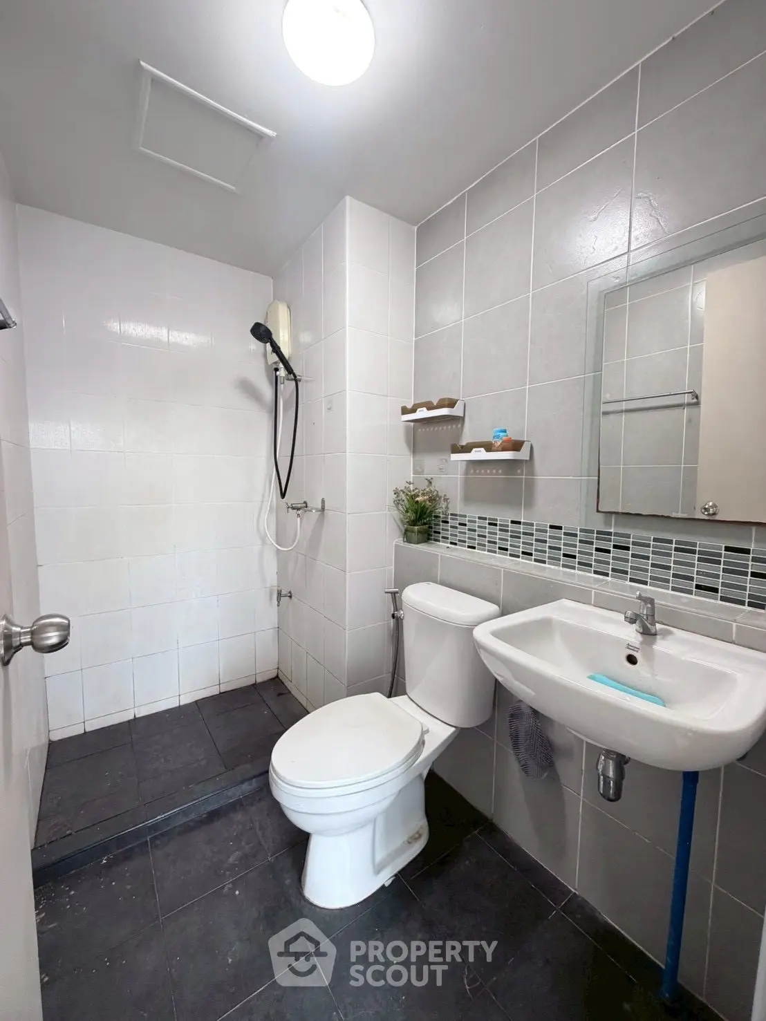 Modern bathroom with sleek white tiles and contemporary fixtures