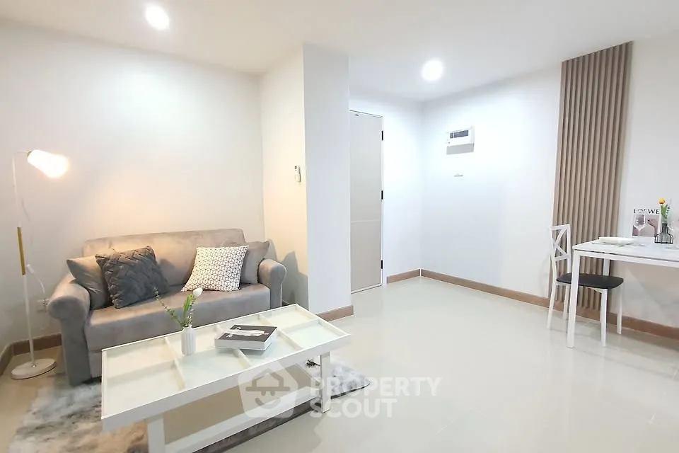Modern living room with cozy sofa and stylish decor