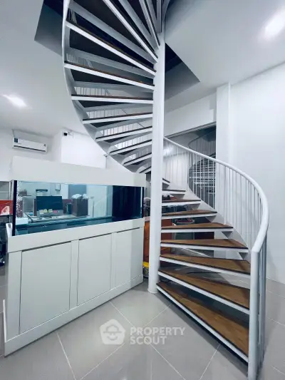 Modern spiral staircase with sleek design in contemporary home interior
