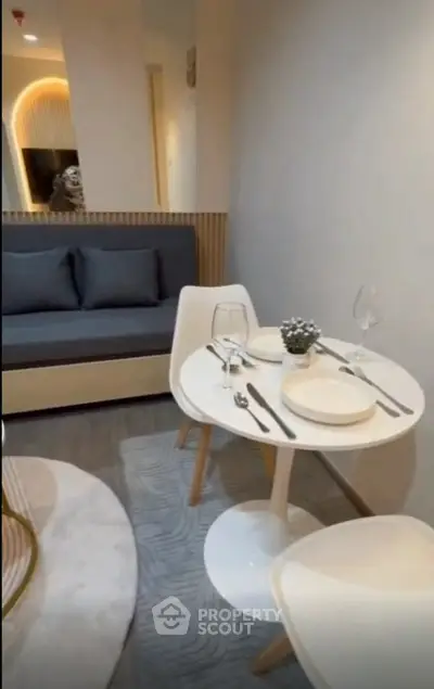 Modern living room with cozy dining area and stylish decor