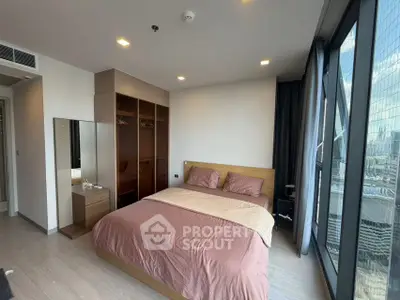 Modern bedroom with city view and spacious wardrobe in luxury apartment