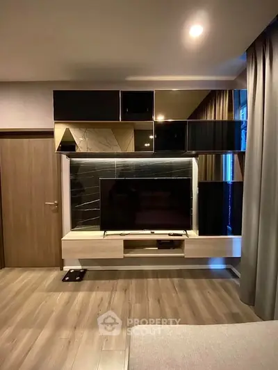 Modern living room with sleek TV unit and stylish cabinetry