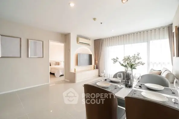 Modern living room with dining area and natural light