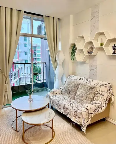 Chic living room with modern decor and balcony view in urban apartment
