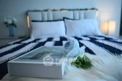 Luxurious bedroom with stylish decor and cozy ambiance, featuring elegant bedding and soft lighting.