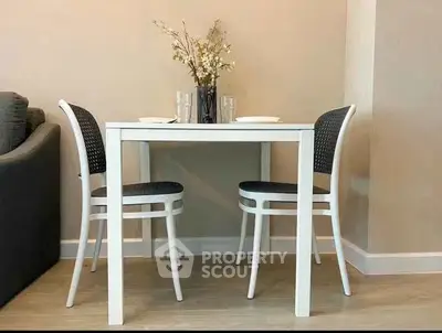 Cozy dining area with modern table and chairs, perfect for intimate meals.