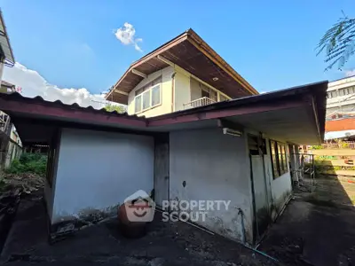 Charming two-story house with rustic exterior and spacious layout in a serene neighborhood.