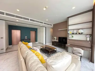 Luxurious living room with modern decor and elegant furnishings, featuring a spacious layout and stylish accents.