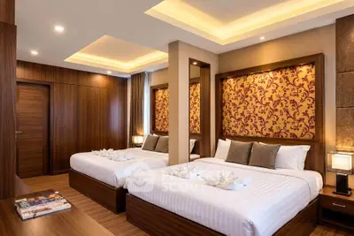 Luxurious double bedroom with elegant decor and ambient lighting