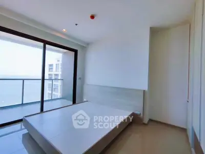 Spacious bedroom with large balcony and stunning view in modern apartment