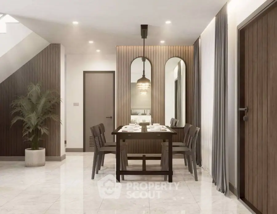 Elegant dining area with modern decor and stylish lighting in a contemporary home.