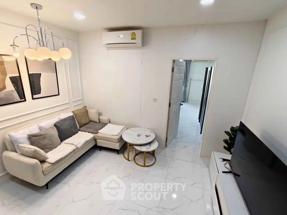 Modern living room with elegant decor and cozy seating area