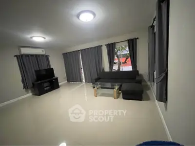 Spacious living room with modern furniture and natural light