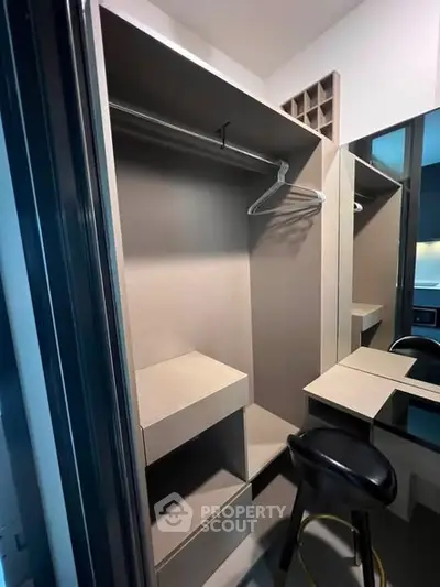 Modern walk-in closet with sleek design and ample storage space