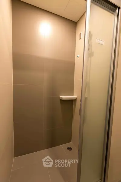 Modern shower stall with sleek design and frosted glass door