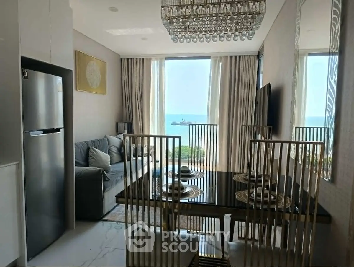 Luxurious living room with ocean view, elegant dining set, and modern decor.