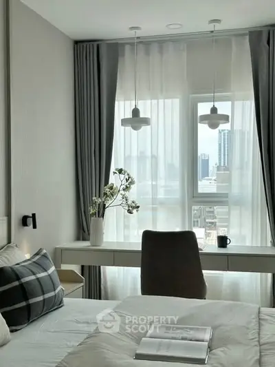 Modern bedroom with city view, stylish decor, and natural light.
