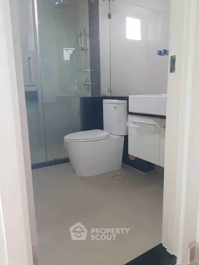 Modern bathroom with glass shower and sleek fixtures